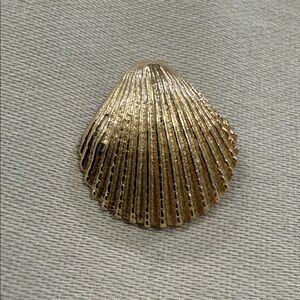 14K Gold Shell Small Pendant measures: 1/2" wide and 1/2 inch long